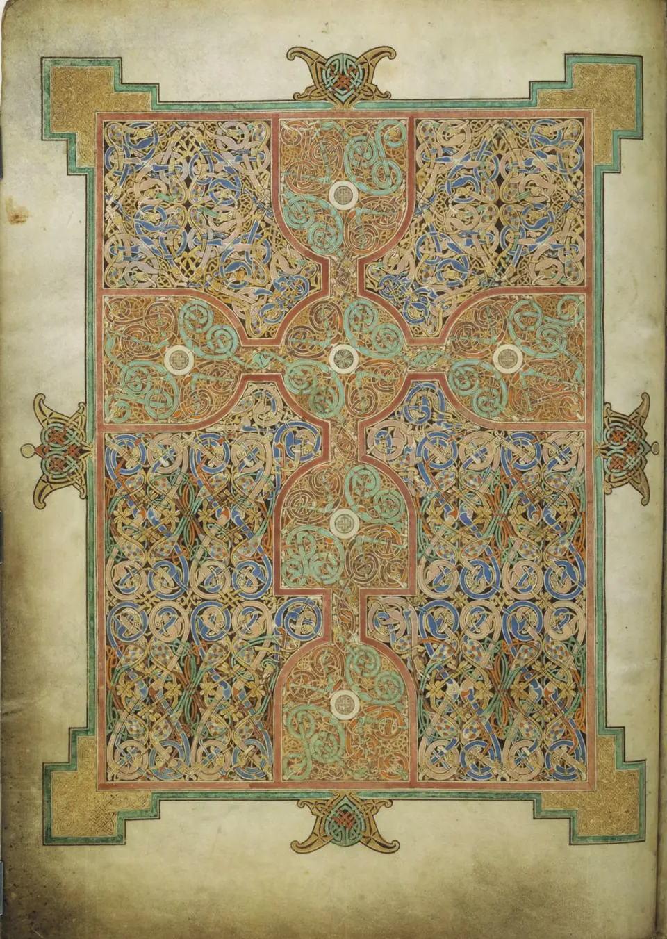 A manuscript page filled with a cross set against dense interlacing bands, knots and stretched animal forms.