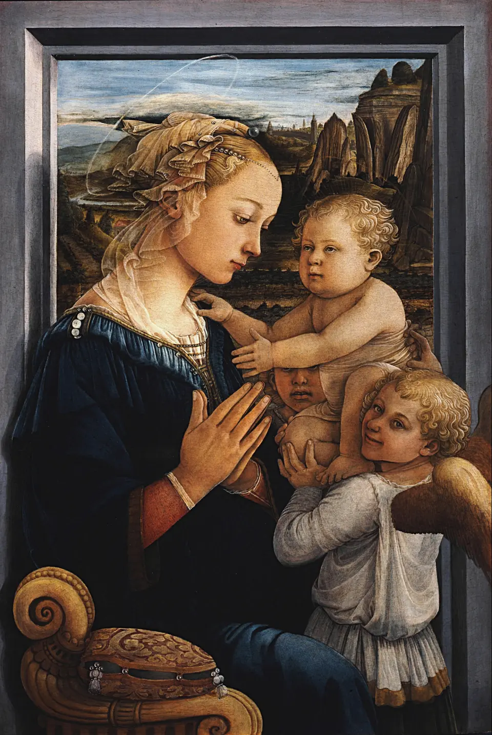 A young woman with a delicate veil prays before a baby held up by two young angels, with a landscape seen through a window behind.