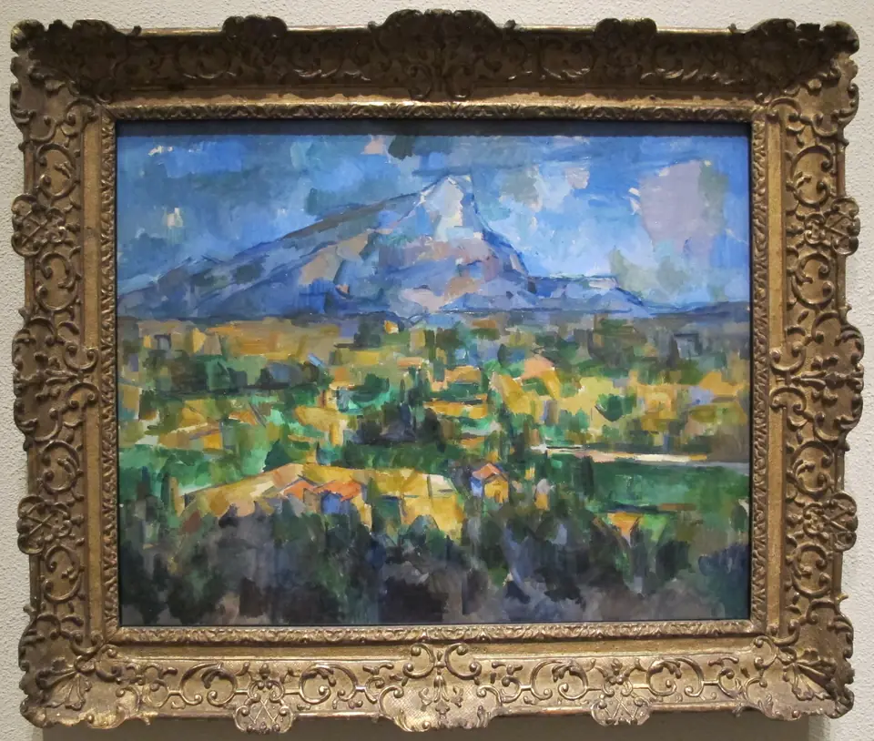 A mountain above a valley painted in blocks and patches of green, ochre and blue.